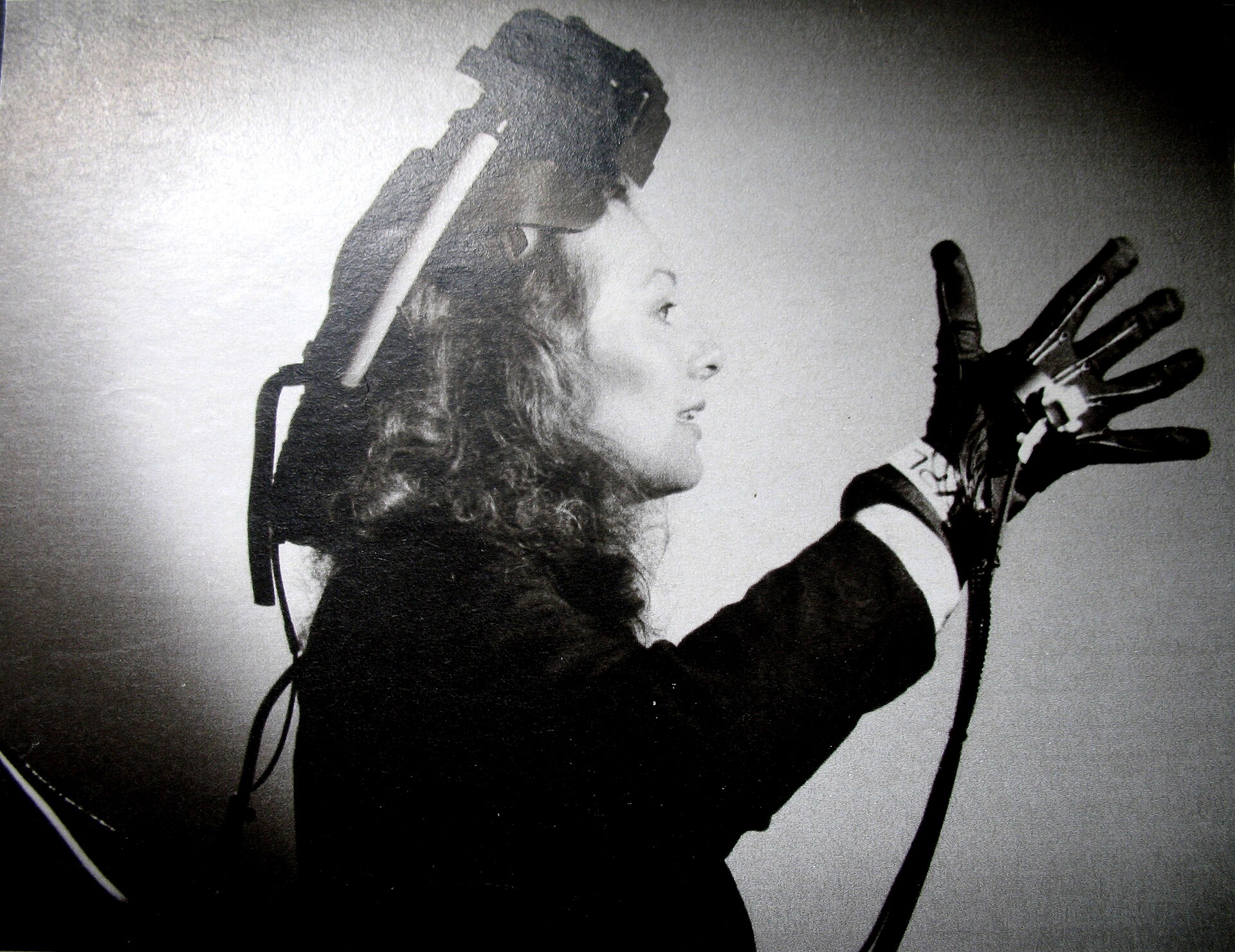 Nicole Stenger wearing a VPL EyePhone headset and DataGlove, circa 1989