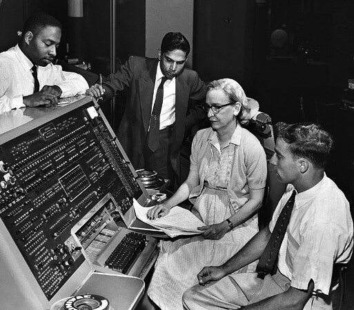 Grace Hopper at the UNIVAC I console with members of the Automatic Programming Department, June 1957